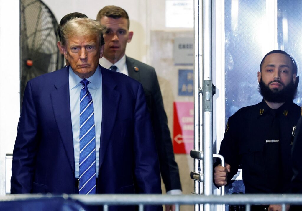 Former U.S. President Donald Trump returns to the courtroom after a break during the second day of his criminal trial at Manhattan Criminal Court in New York City, U.S., on April 16, 2024. Jury selection continues in the criminal trial of the former president, who faces 34 felony counts of falsifying business records in the first of his criminal cases to go to trial. This is the first-ever criminal trial against a former president of the United States. Michael M. Santiago/Pool via REUTERS