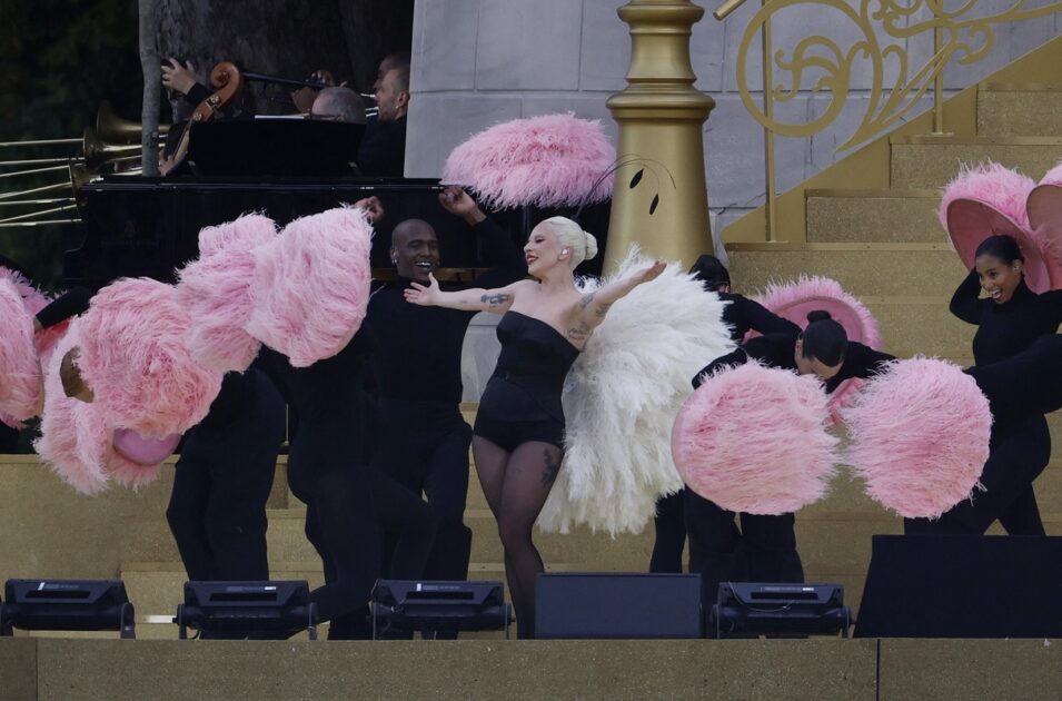 Lady Gaga sang a French cabaret song near Notre-Dame cathedral, athletes were cheered by the crowd along the Seine in the pouring rain, and dancers took to the roofs of Paris in the Olympics' opening ceremony on Friday.