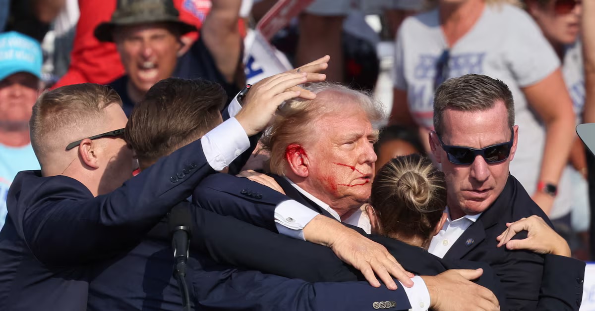 Gunfire erupted at a Donald Trump rally on Saturday, sparking panic in the crowd and spattering the Republican presidential candidate with blood, before he emerged and defiantly pumped his fist in the air and was ushered to a waiting car.