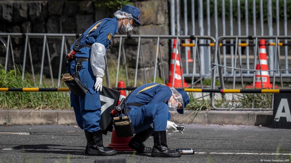 A man was arrested in Tokyo after allegedly throwing what appeared to be Molotov cocktails at Japan's ruling party headquarters and ramming his car into a fence outside the prime minister's office, police said.