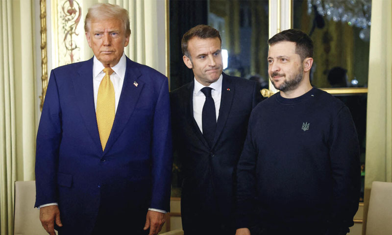 Trump, returning to the world stage before he takes office next month, gave Zelenskiy a firm handshake and patted him on the back, before Macron stood between them to pose for photos.