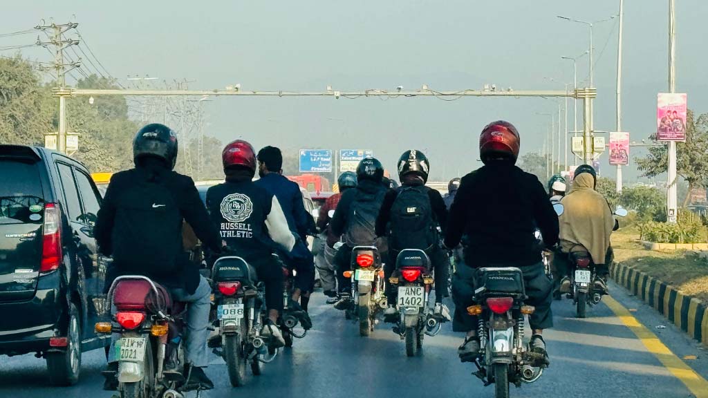 Motorcyclists in Islamabad fast lane