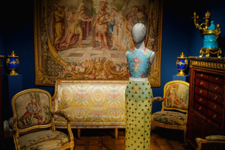 The Louvre in Paris opened its first-ever fashion exhibition, seeking to draw new, younger audiences amid national concern.