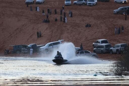 A temporary lake in Saudi Arabia, creates a rare opportunity for locals and visitors to engage in watersports like jet skiing in the desert.