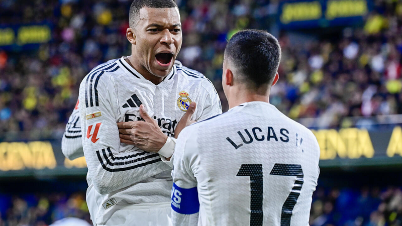 Kylian Mbappe scored two goals to help Real Madrid climb to the top of La Liga with a 2-1 win at Villarreal on Saturday.