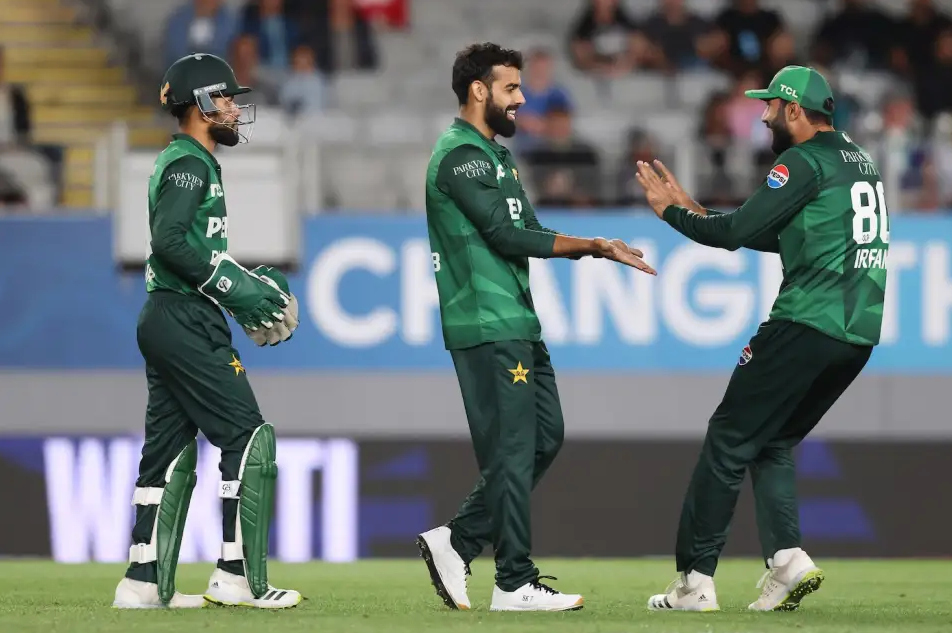Shadab Khan celebrates after Daryl Mitchell's dismissal.