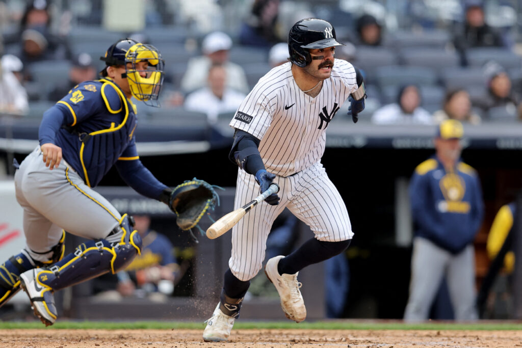 Mar 30, 2025; Bronx, New York, USA; New York Yankees catcher Austin Wells (28) follows through on an RBI groundout against the Milwaukee Brewers during the sixth inning at Yankee Stadium. Mandatory Credit: Brad Penner-Imagn Images