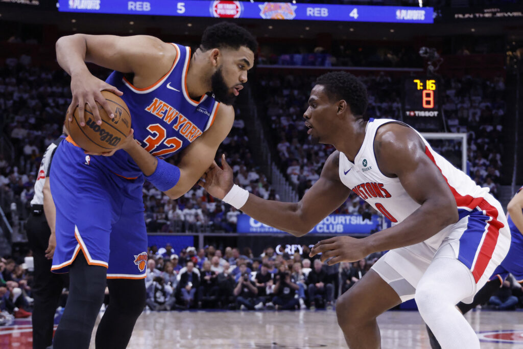 May 1, 2025; Detroit, Michigan, USA; New York Knicks center Karl-Anthony Towns (32) is defended by Detroit Pistons center Jalen Duren (0) in the first half during game six of first round for the 2024 NBA Playoffs at Little Caesars Arena. Mandatory Credit: Rick Osentoski-Imagn Images