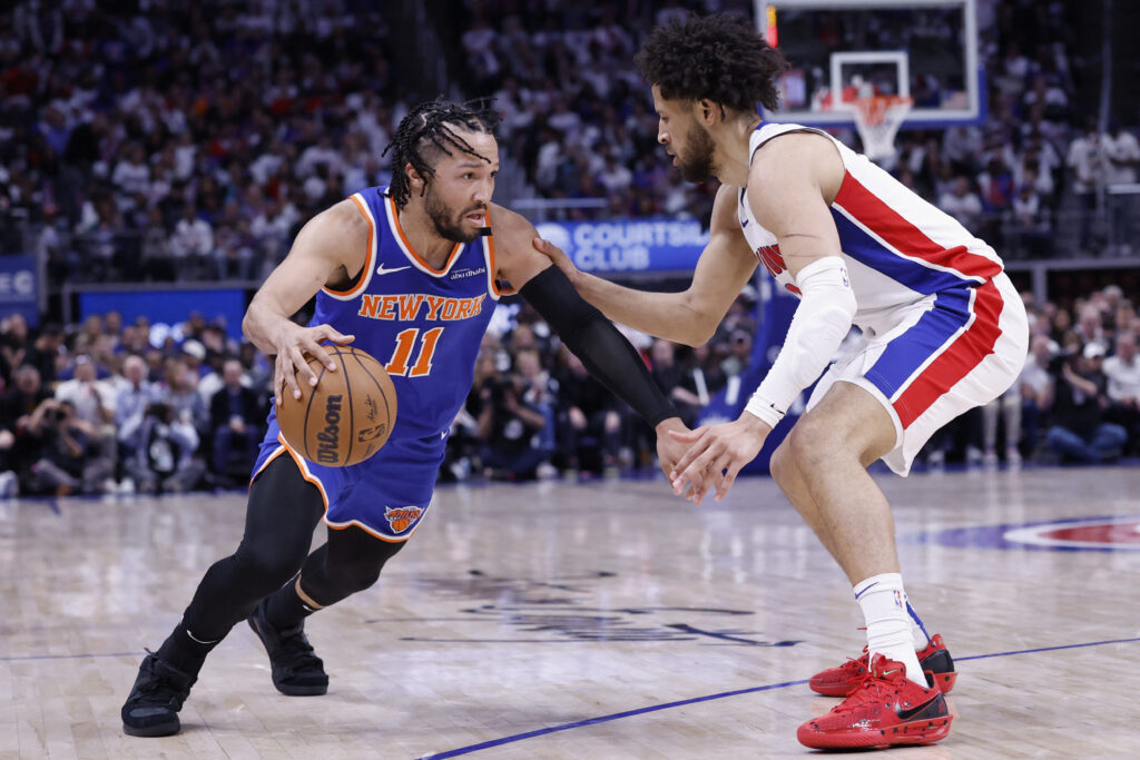 May 1, 2025; Detroit, Michigan, USA; New York Knicks guard Jalen Brunson (11) dribbles on Detroit Pistons guard Cade Cunningham (2) in the first half during game six of first round for the 2024 NBA Playoffs at Little Caesars Arena. Mandatory Credit: Rick Osentoski-Imagn Images