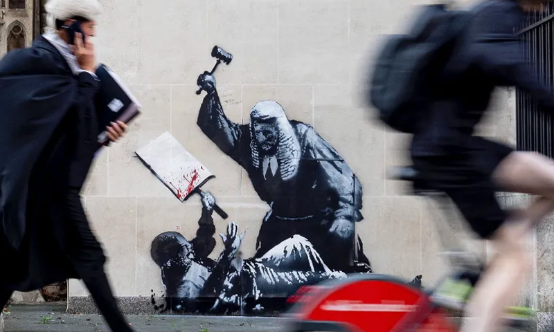 Two identical Banksy murals appear in London highlighting child homelessness