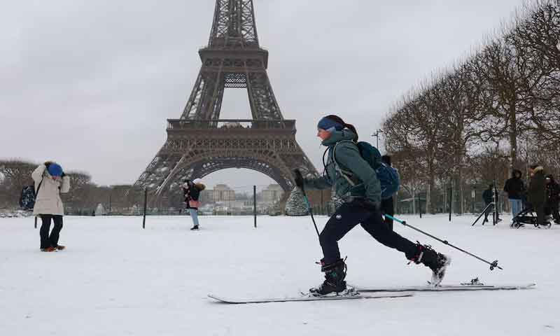 Snow paralyses transport across Europe as Parisians take to skis